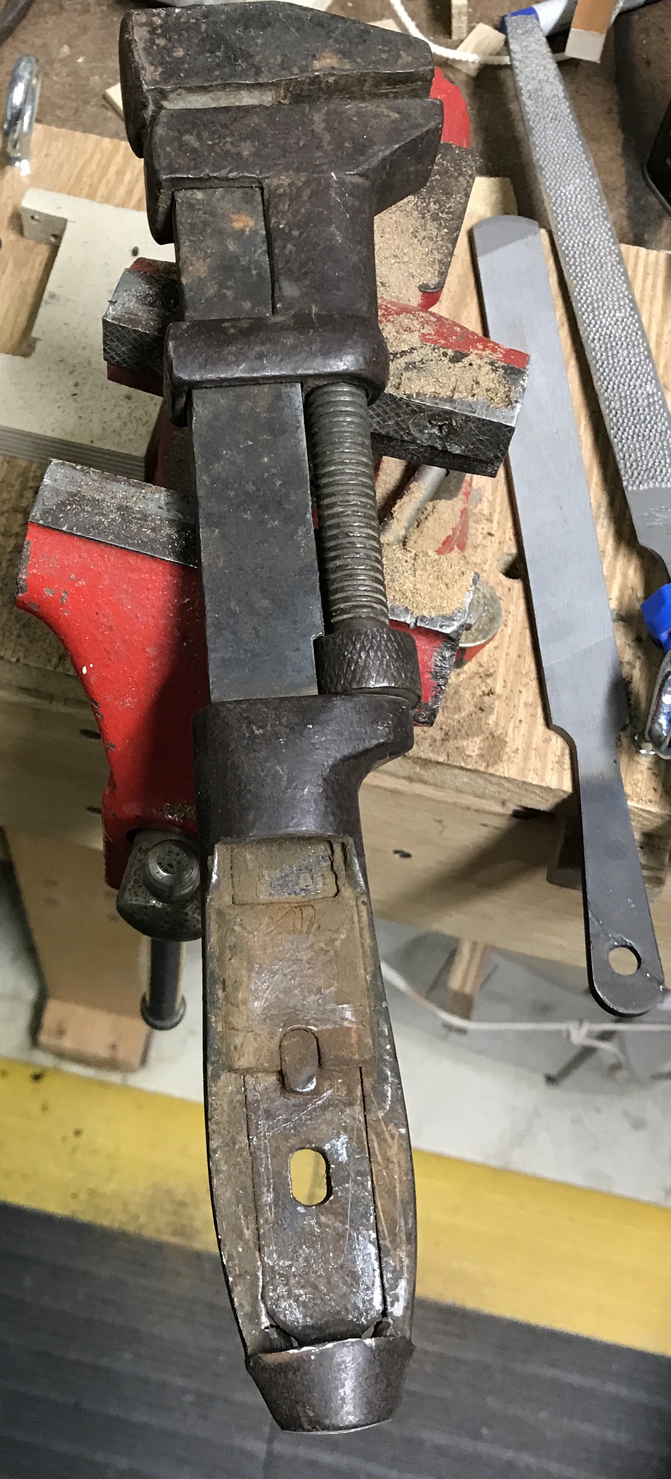 The monkey wrench sans wooden handle